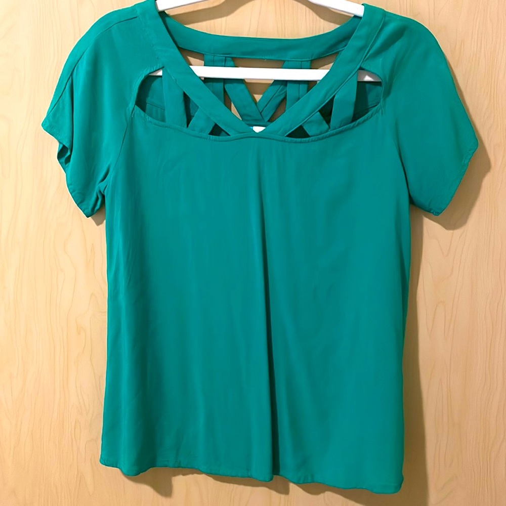 Green shirt with caging neckline